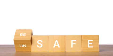 Wooden blocks with safe and unsafe text for risk and security concept, isolated on transparent background