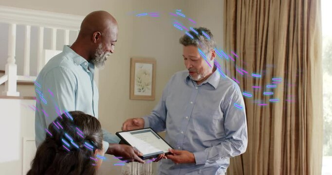 Two men shaking hands at table, right handing framed business award, recipient reading with overlay