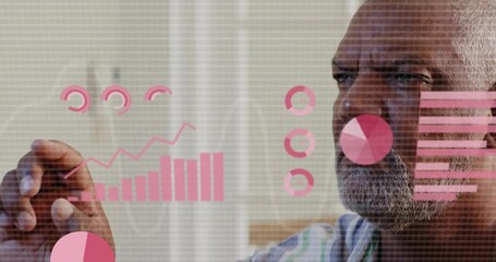 Senior man using finger gestures in home, animating pie charts and bar charts for data analysis - Powered by Adobe