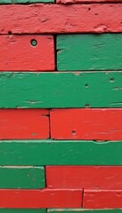 A vibrant wall of alternating red and green wooden planks, Christmas Theme, showcasing a rustic texture and a playful color scheme.