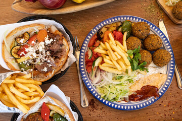 Doner kebab and falafel plates with fries