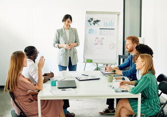 Group of young business people having a meeting or presentation and seminar with whiteboard in the office. Portrait of a young businesswoman leader