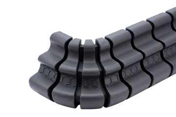 Flexible articulated black plastic spine for cable management isolated with transparent background