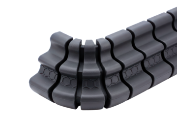 Flexible articulated black plastic spine for cable management isolated with transparent background