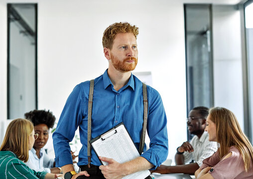 Portrait of a group of young business people having a meeting in the office. Teamwork and success concept, portrait of azoung businessman