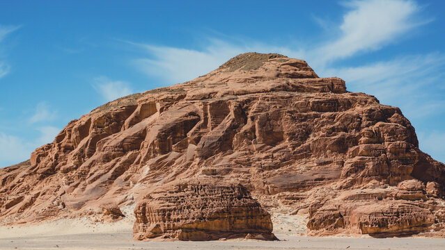 landscape of rocky mountains and desert and sky on a sunny day in Egyp