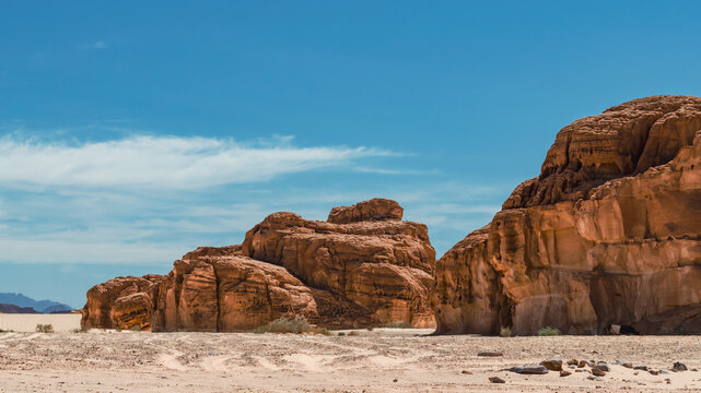 landscape of rocky mountains and desert and sky on a sunny day in Egyp