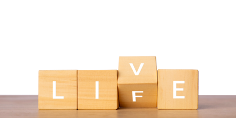 Wooden blocks with live life word for positive lifestyle concept, isolated on transparent background