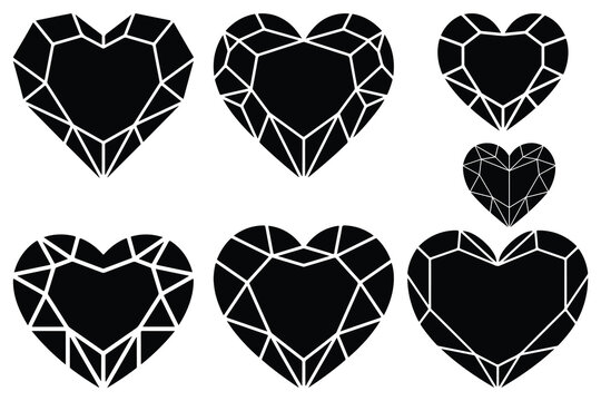 Black faceted heart shaped gemstones on white background
