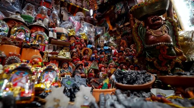 Close up to souvenir shop stock with crafted statues. Spiritual. Witches Market, La Paz, Bolivia
