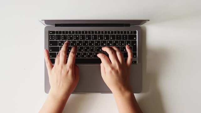 Hands and fingers of woman pressing buttons on keyboard, typing on laptop and scrolling and work office table, using modern technology, digital gadget for business. Close up , Flatlay and top view