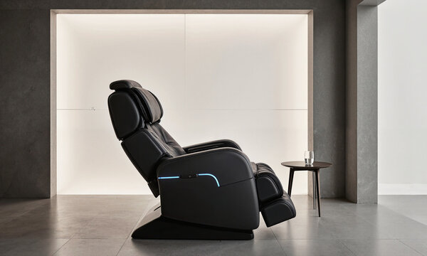 Zero-Gravity Massage Chair. A dedicated wellness room featuring a state-of-the-art, futuristic-looking zero-gravity massage chair. The chair is in its fully