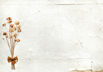 Retro background with dry pressed leaves and flowers on paper texture. Craft eco paper sheet backdrop with grunge textured and herbarium. Nostalgic scrapbooking banner with vintage cardboard materia