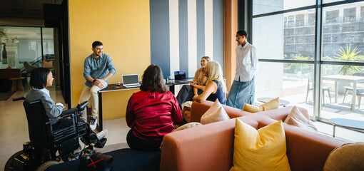 Diverse team having a collaborative discussion in a modern office setting