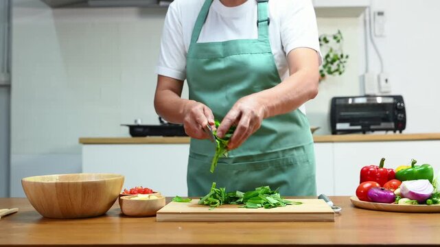 Fresh vegetables being chopped for a healthy meal, showcasing culinary skills and home cooking with kitchen tools and organic ingredients for delicious, healthy recipes.