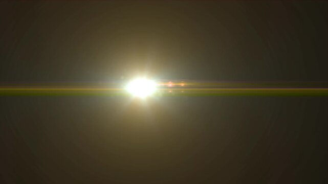 Flashing rays of light in the middle of the screen creating a flare effect, reflections on a dark background, abstraction.