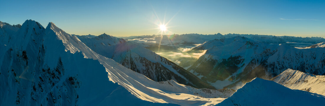 Fototapeta Panorama view of a snow-covered high mountains in Austria Alps