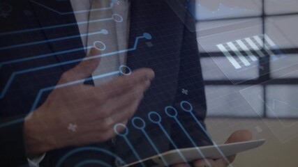 Man in suit tapping tablet screen and animating HUD circuit nodes while analyzing tech data - Powered by Adobe