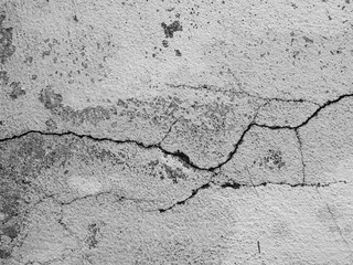 Obraz premium Crack wall texture background broken earthquake effect, whtie grey building cement damage pattern plaster grunge black line paint surface abstract, construction rough street concrete backdrop.
