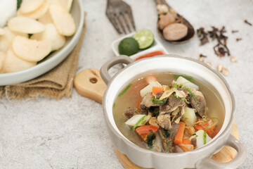 Indonesian Beef Vegetable Soup with Rice Crackers and Spices