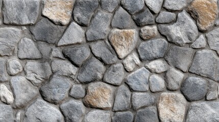 Grey stone wall texture with various sized rocks and mortar. Natural boulder surface for exterior design or rustic background use.