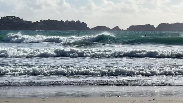 Paguera beach with strong wind , high Waves and Surfer, Calvia, Mallorca, Spain