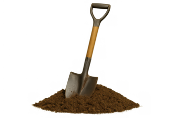 Shovel standing in a pile of fresh brown soil, ready for digging, gardening, or construction work