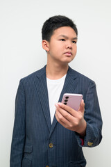 Asian Teenage Boy in Suit Studio Portrait Using Mobile Phone