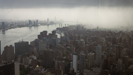 City Skyline in Misty MorningMisty cityscape with high-rise buildings near the river, creating a serene and atmospheric urban view.city