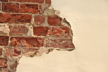 Old brown brickwork with peeling plaster, wall, copy space