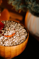 Peeled roasted sunflower seeds in a wooden bowl ready for snacking