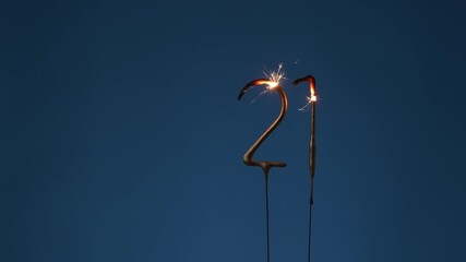 21 years legal age celebration festive background made with Bengal fires in the form of number Twenty-one.