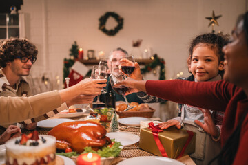 Fototapeta premium Joyful holiday gathering with friends sharing festive cookies, enjoying roast turkey, and sipping red wine in a warm atmosphere filled with laughter, desserts, and seasonal decorations