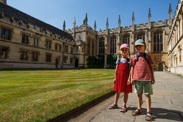 Young siblings enjoy All Souls College, Oxford, Great Britain