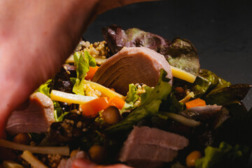 Bowl of salad with tuna steak