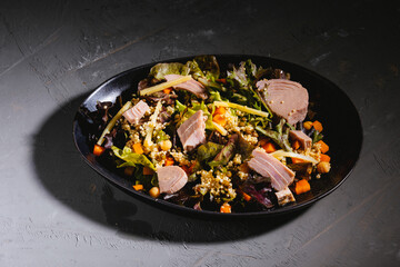 Bowl of salad with tuna steak