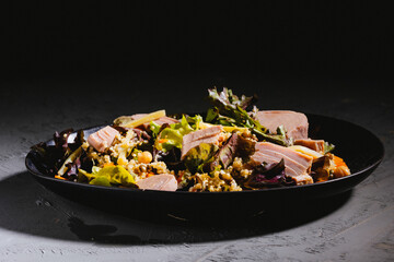 Bowl of salad with tuna steak