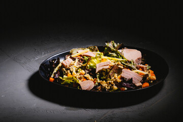 Bowl of salad with tuna steak