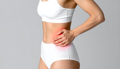 Man experiencing pain in the hip area due to osteoarthritis while wearing a sports bra and shorts