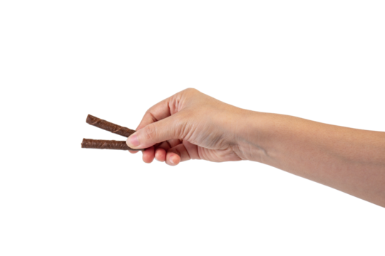 Chocolate bar in hand on transparent background