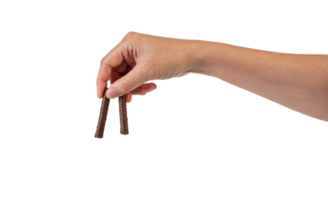 Chocolate bar in hand on transparent background