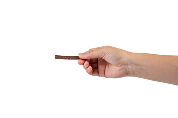 Chocolate bar in hand on transparent background