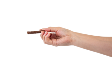 Chocolate bar in hand on transparent background