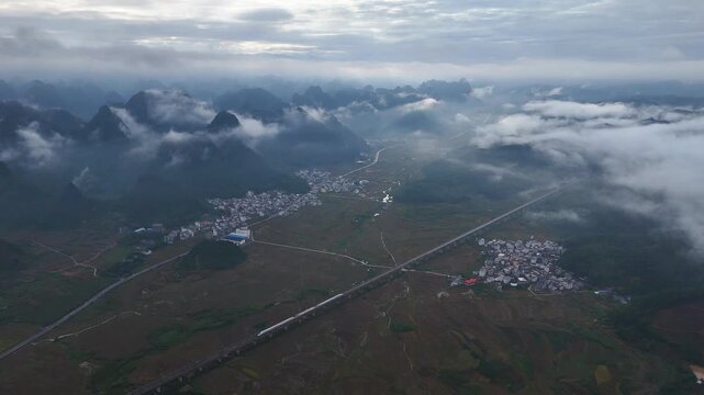 Aerial Drone Shot of Railway in Foggy Karst Region