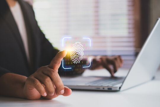Biometric fingerprint scan authentication on laptop with digital security technology, Businessman using fingerprint recognition for identity verification and data protection with laptop in workplace
