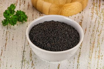Black dry Nigella seeds in the bowl