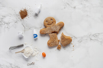 Broken gingerbread man on the table