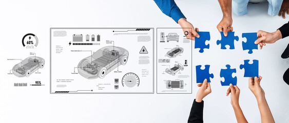 A diverse team engages in the design and assembly of an electric vehicle, illustrating innovation...