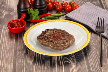Grilled beef burger cutlet with sauce