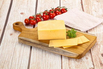 Yellow cheese piece with slices